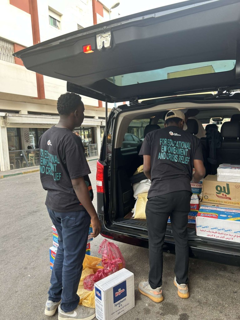 Tayb Foundation Morocco outreach — Organizing rice, oil, pasta, and pantry staples for students